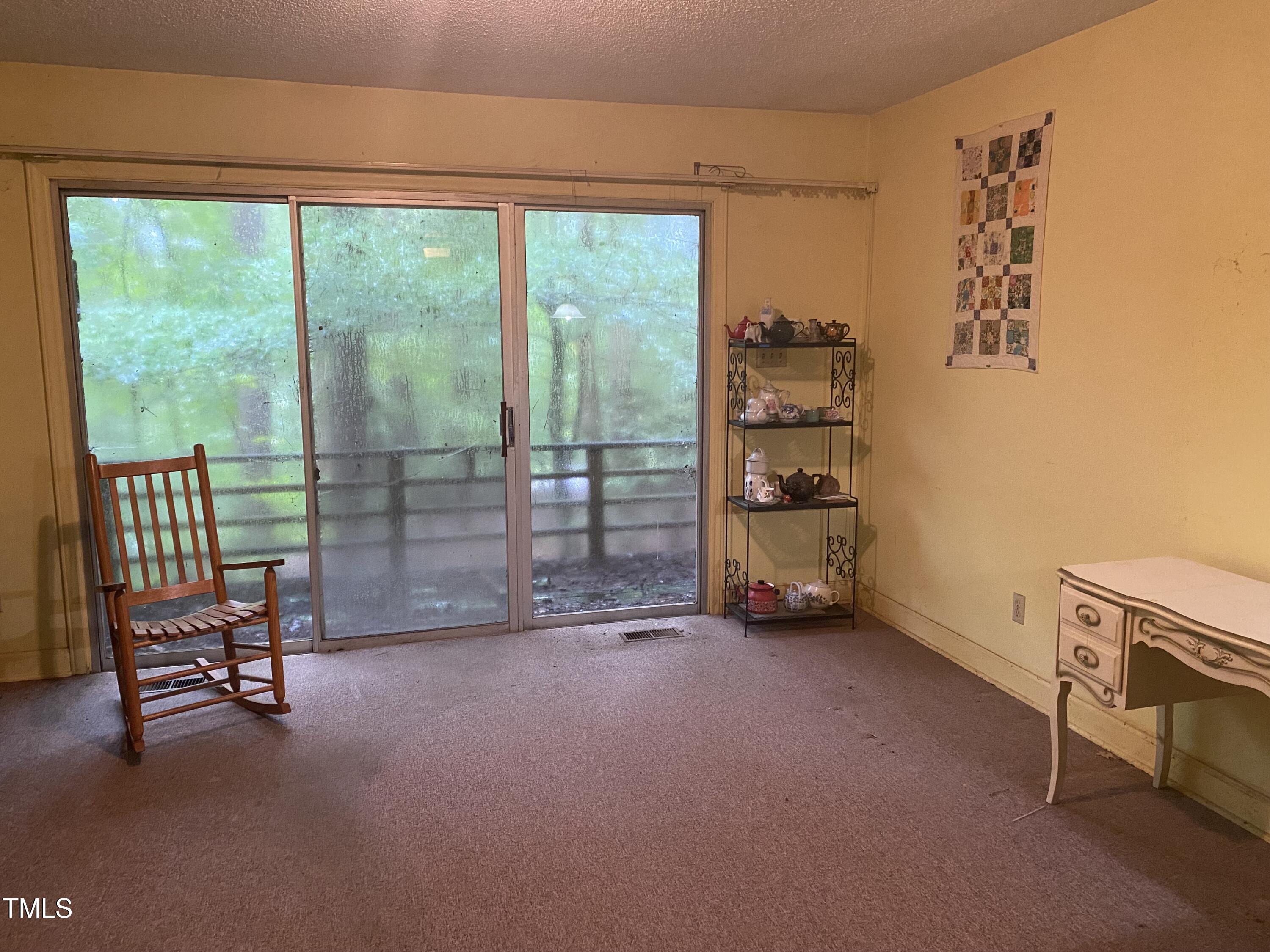 412 North Elliott Road Chapel Hill, NC 27514 - Photo 5 of 15 a view of a room with gym equipment and a large window