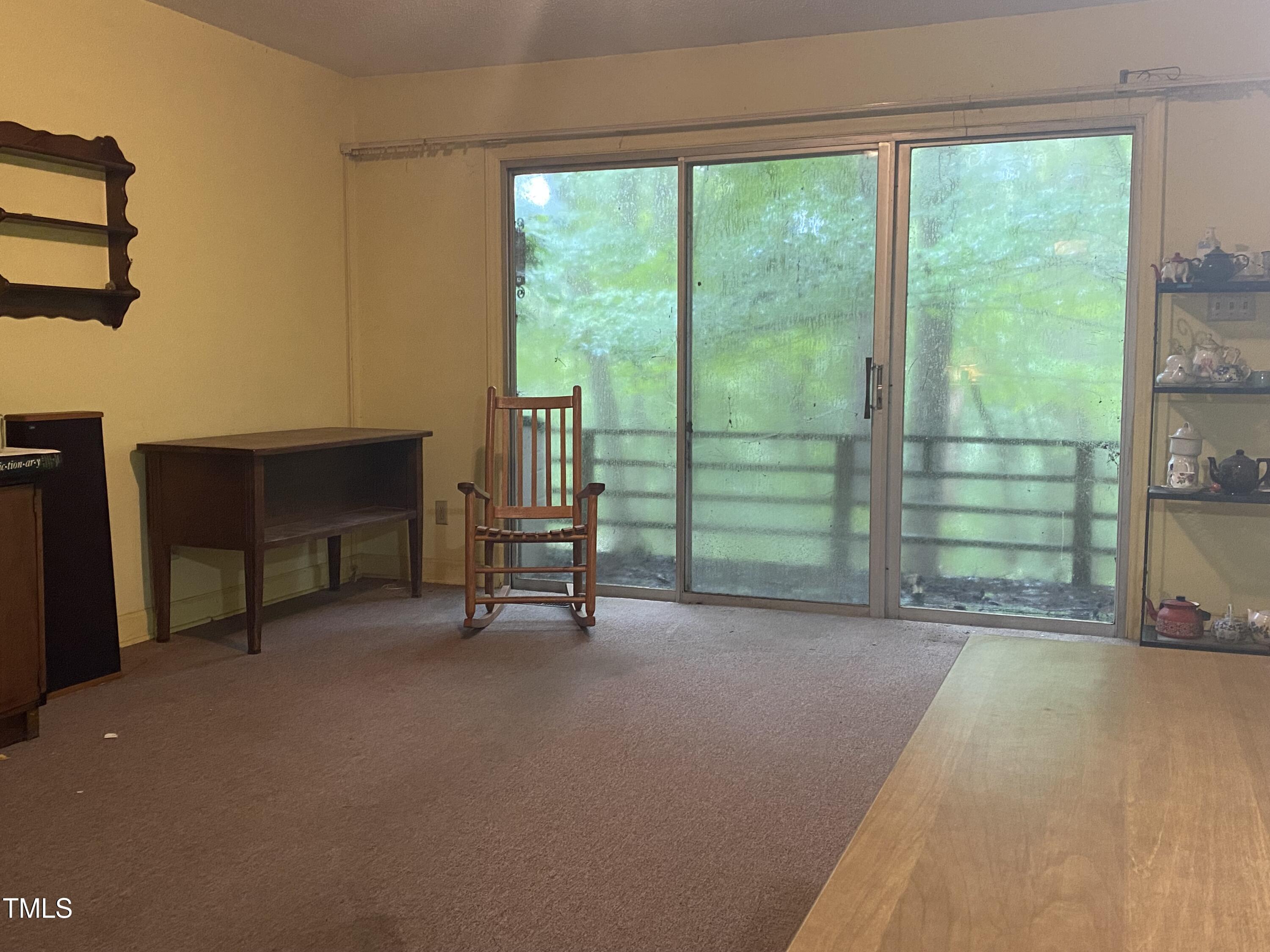 412 North Elliott Road Chapel Hill, NC 27514 - Photo 6 of 15 a view of an empty room with furniture and a window