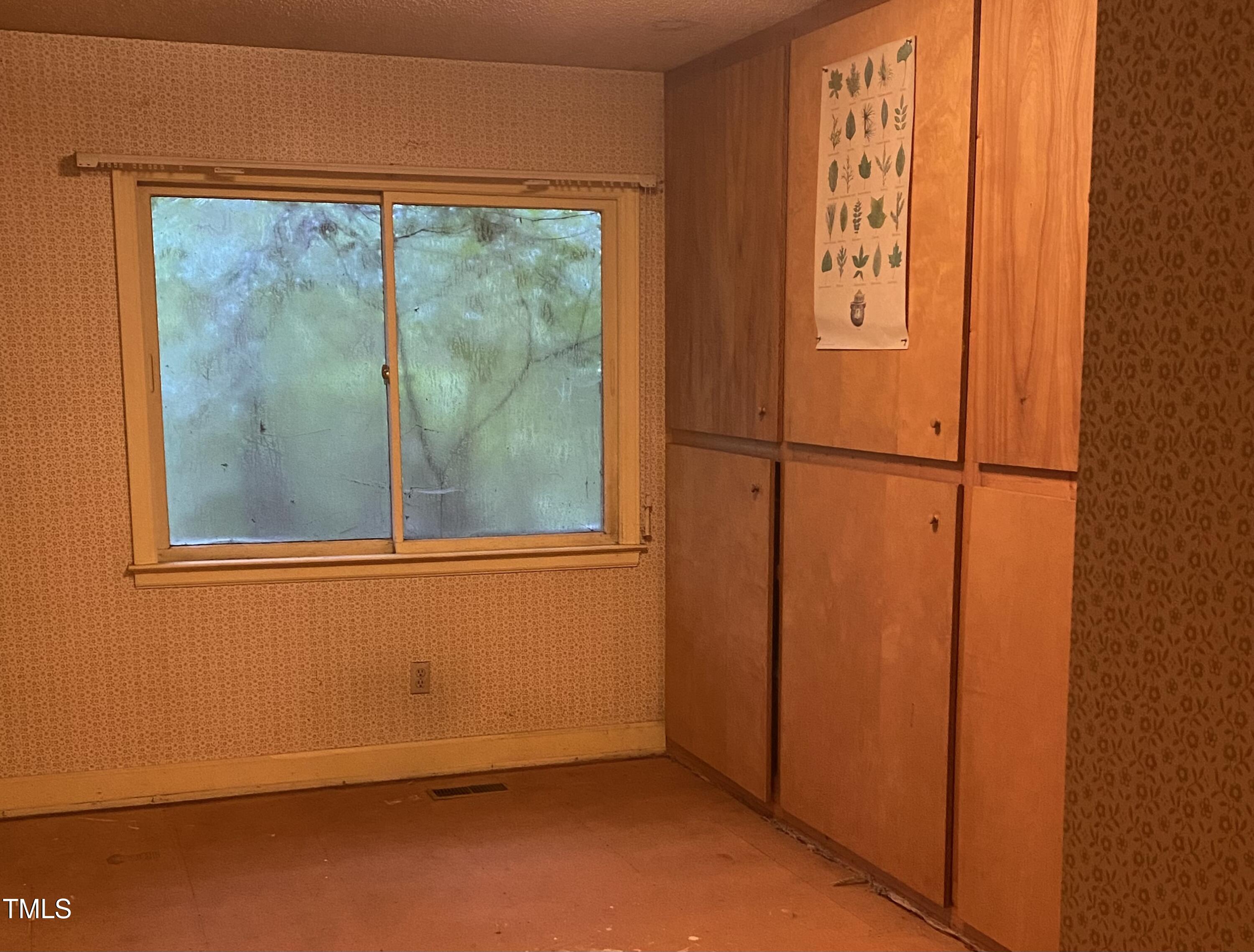 412 North Elliott Road Chapel Hill, NC 27514 - Photo 8 of 15 an empty room with wooden floor and windows