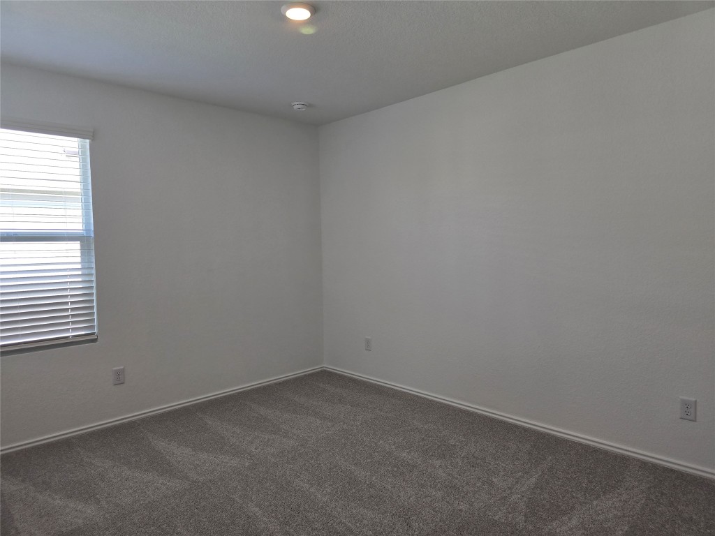 1036 Soapstone Pass Maxwell, TX 78656 - Photo 11 of 15 an empty room with a window