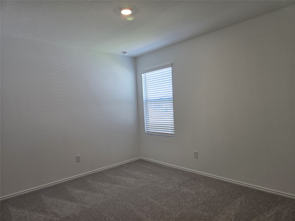 1036 Soapstone Pass Maxwell, TX 78656 - Photo 12 of 15 an empty room with a window