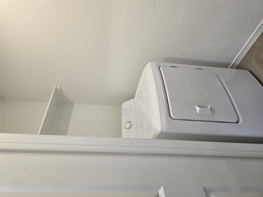 1036 Soapstone Pass Maxwell, TX 78656 - Photo 13 of 15 a utility room with dryer and washer