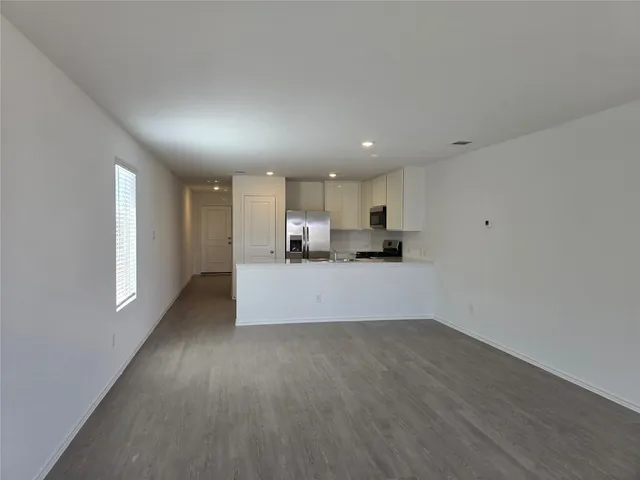 a view of kitchen with wooden floor