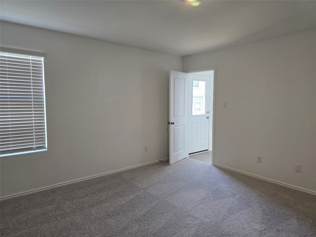 1036 Soapstone Pass Maxwell, TX 78656 - Photo 9 of 15 an empty room with windows