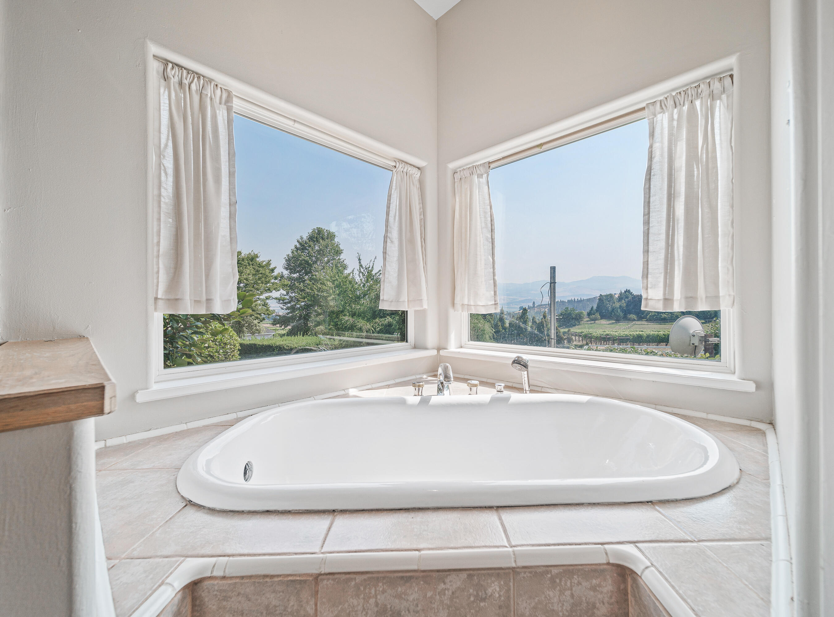 925 Anderson Creek Road Talent, OR 97540 - Photo 30 of 52 a bathroom with a bathtub and window