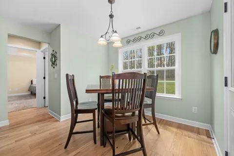 a front view of a house with a garden and porch