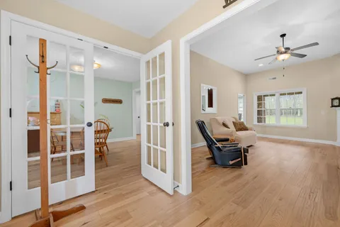 a view of a dining room with furniture and window