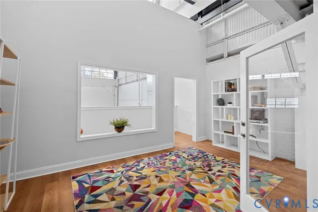 a view of a room with wooden floor