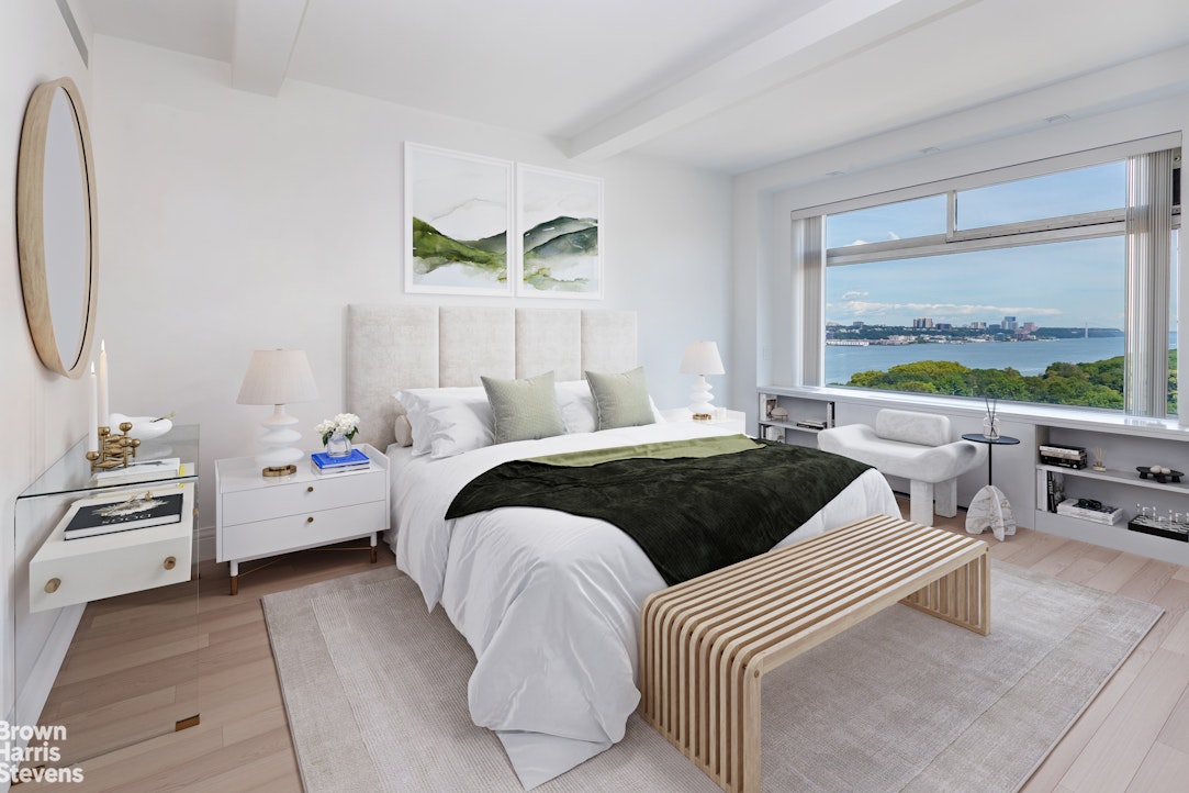 37 Riverside Drive, Unit 12B Manhattan, NY 10023 - Photo 11 of 20 a bedroom with a bed and a large window