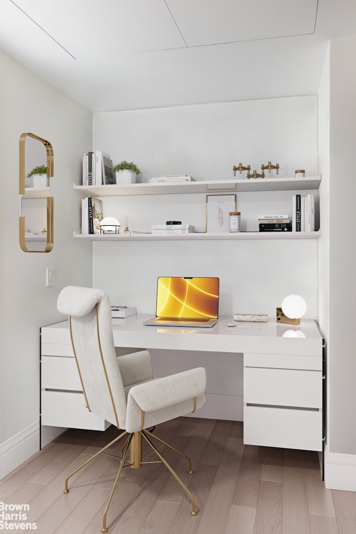 37 Riverside Drive, Unit 12B Manhattan, NY 10023 - Photo 12 of 20 a living room with a couch and a table