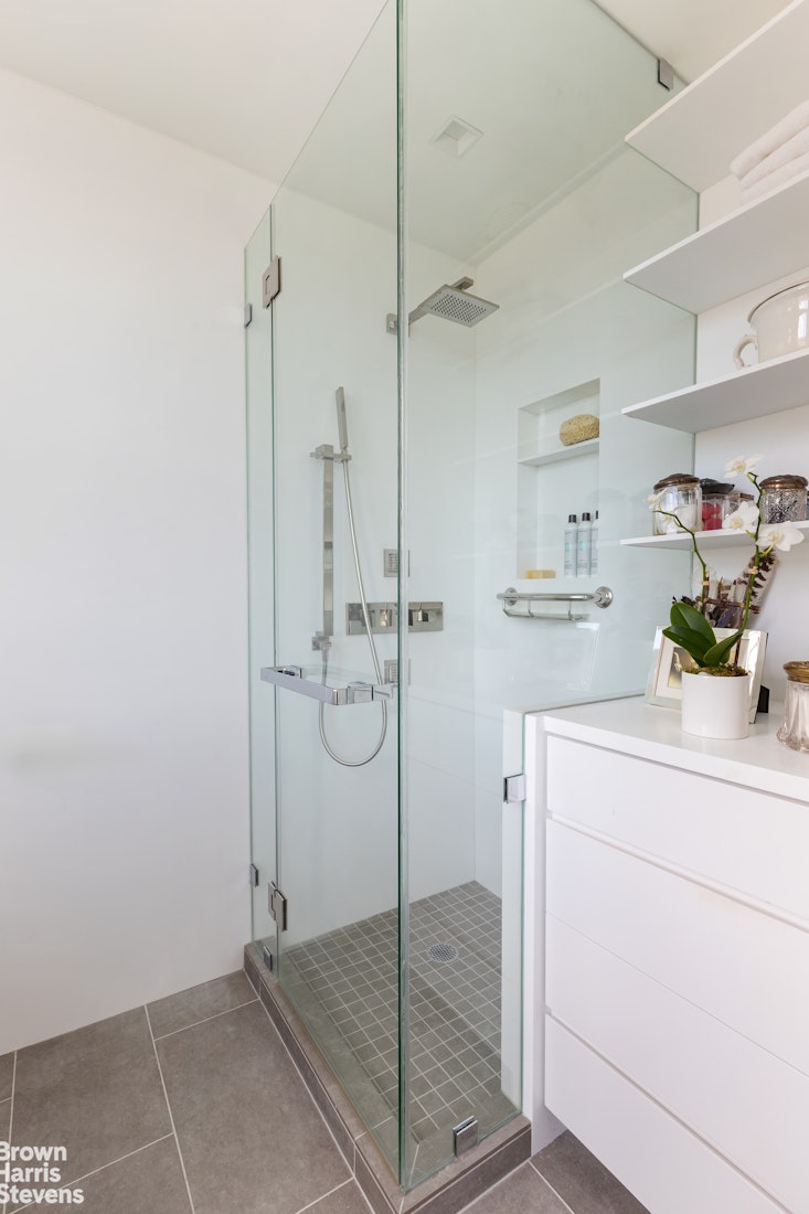 37 Riverside Drive, Unit 12B Manhattan, NY 10023 - Photo 13 of 20 a bathroom with a shower