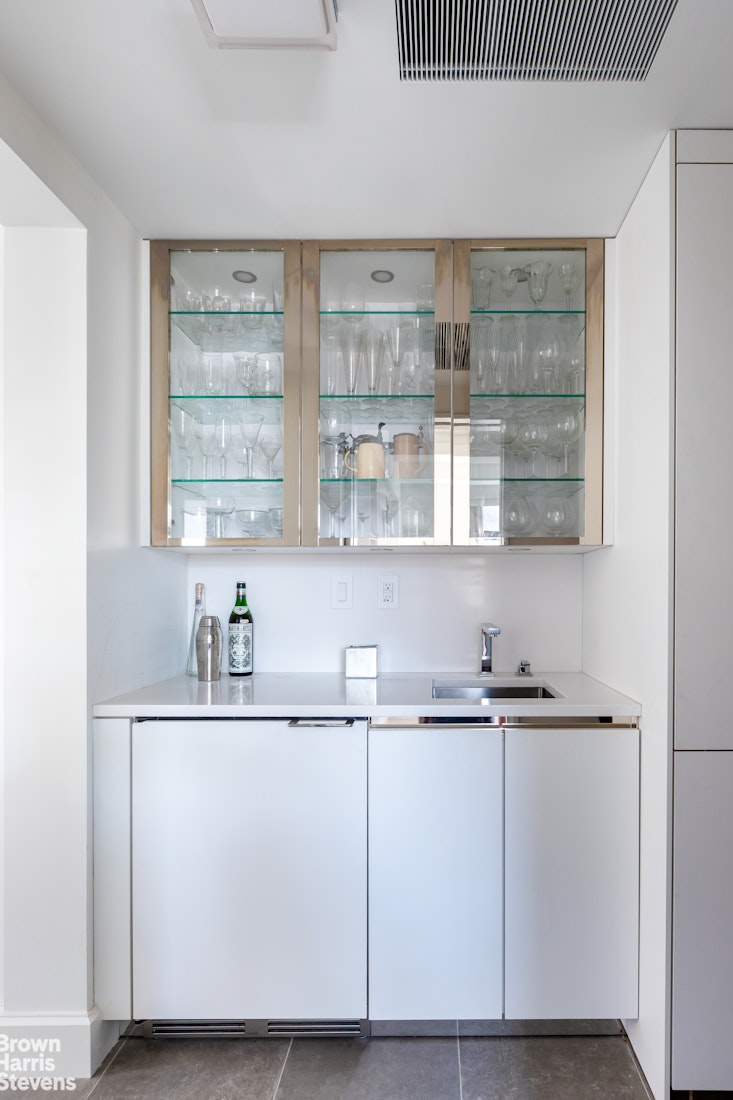37 Riverside Drive, Unit 12B Manhattan, NY 10023 - Photo 8 of 20 a kitchen with a sink and cabinets
