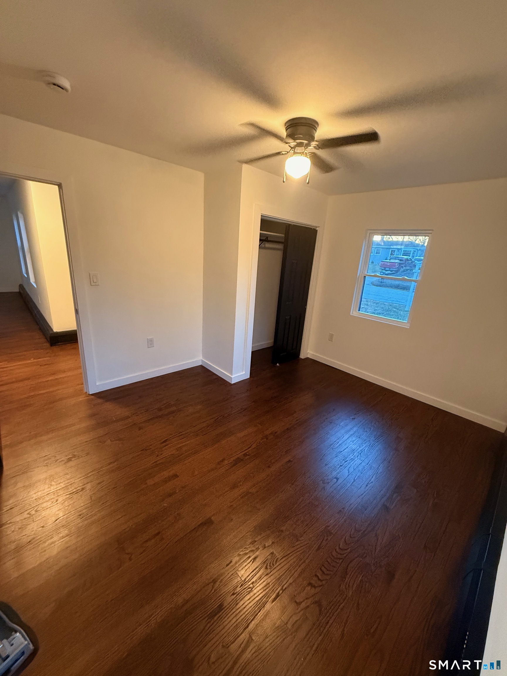 8 Eddy Road Montville, CT 06370 - Photo 6 of 13 a view of an empty room with wooden floor and a ceiling fan