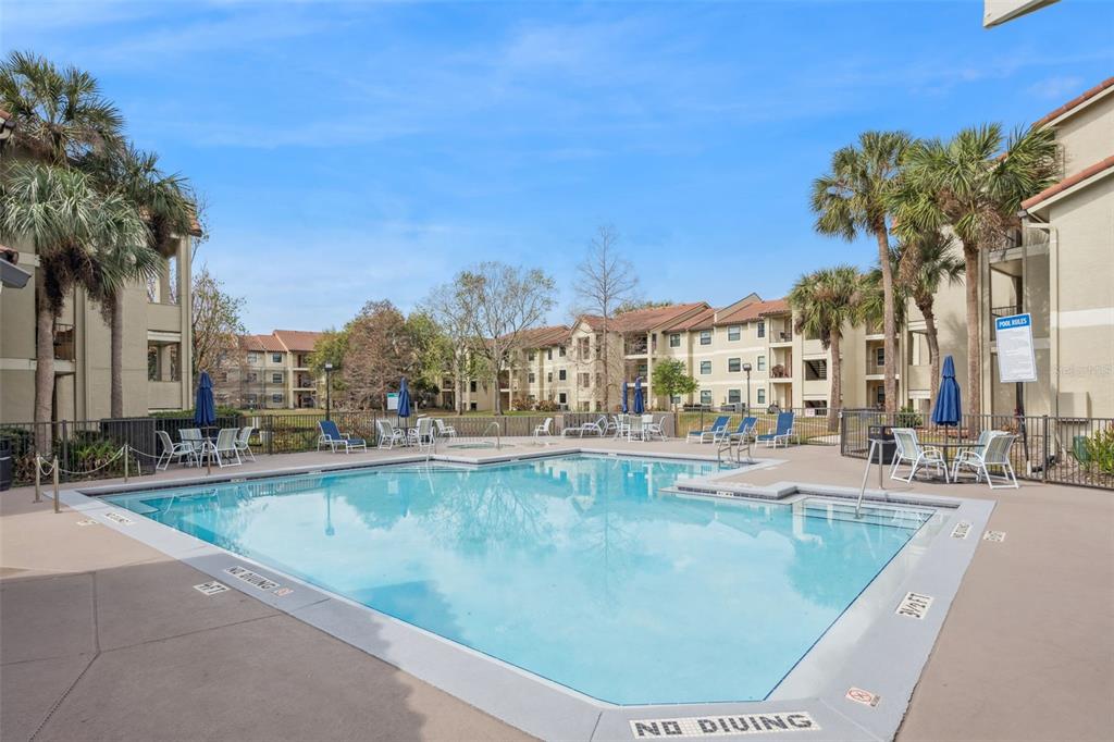 3032 Parkway Boulevard, Unit 305 Kissimmee, FL 34747 - Photo 23 of 40 a view of swimming pool outdoor seating and city view
