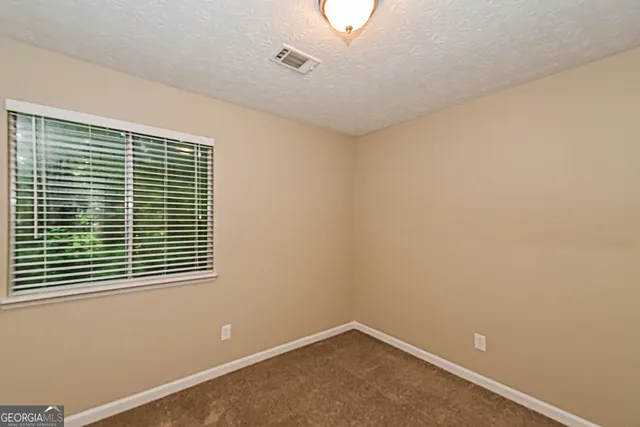 a view of a room that has a window in it