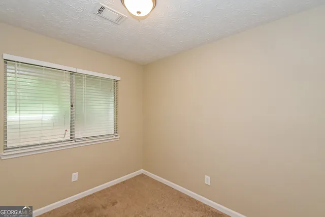 a view of a room that has a window in it