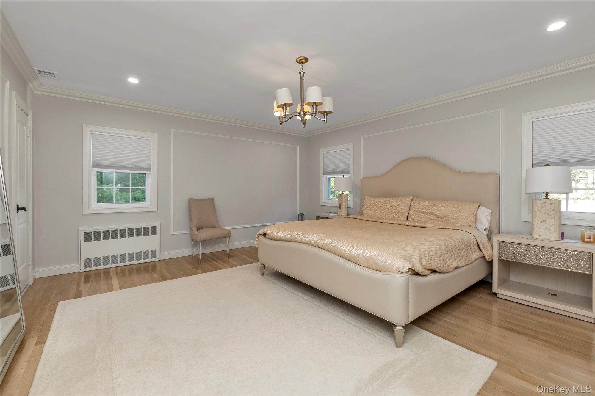 47 Pinewood Road Roslyn, NY 11576 - Photo 12 of 22 a bedroom with a large bed and a window