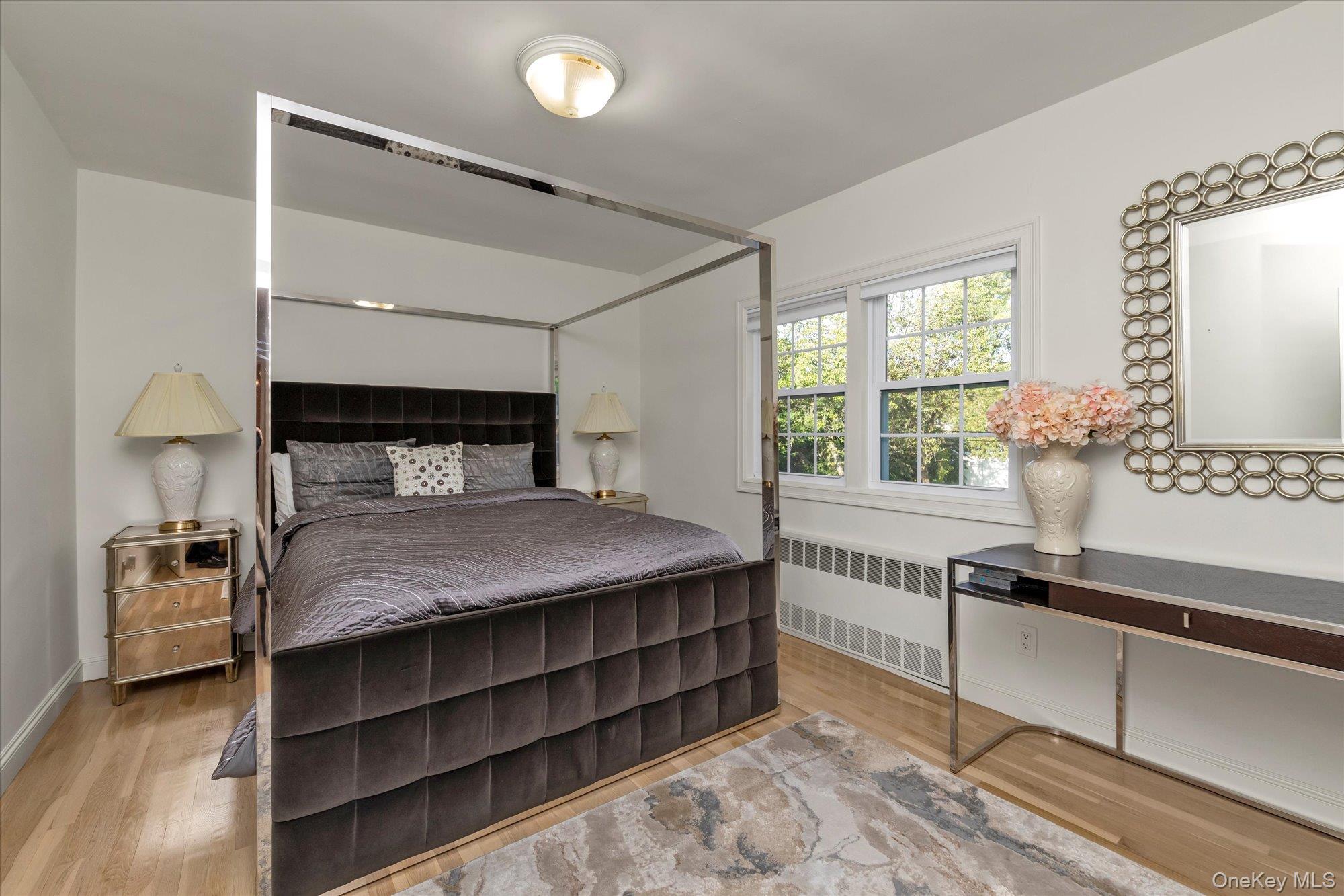 47 Pinewood Road Roslyn, NY 11576 - Photo 14 of 22 a bedroom with a bed and a window