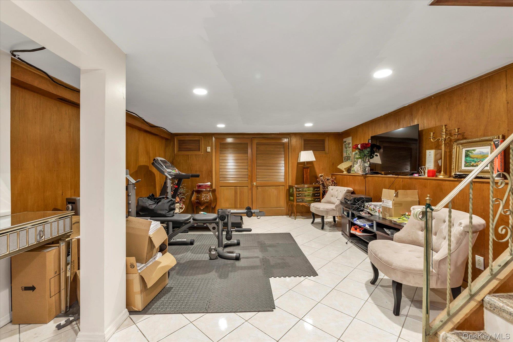 47 Pinewood Road Roslyn, NY 11576 - Photo 19 of 22 a view of a room with gym equipment