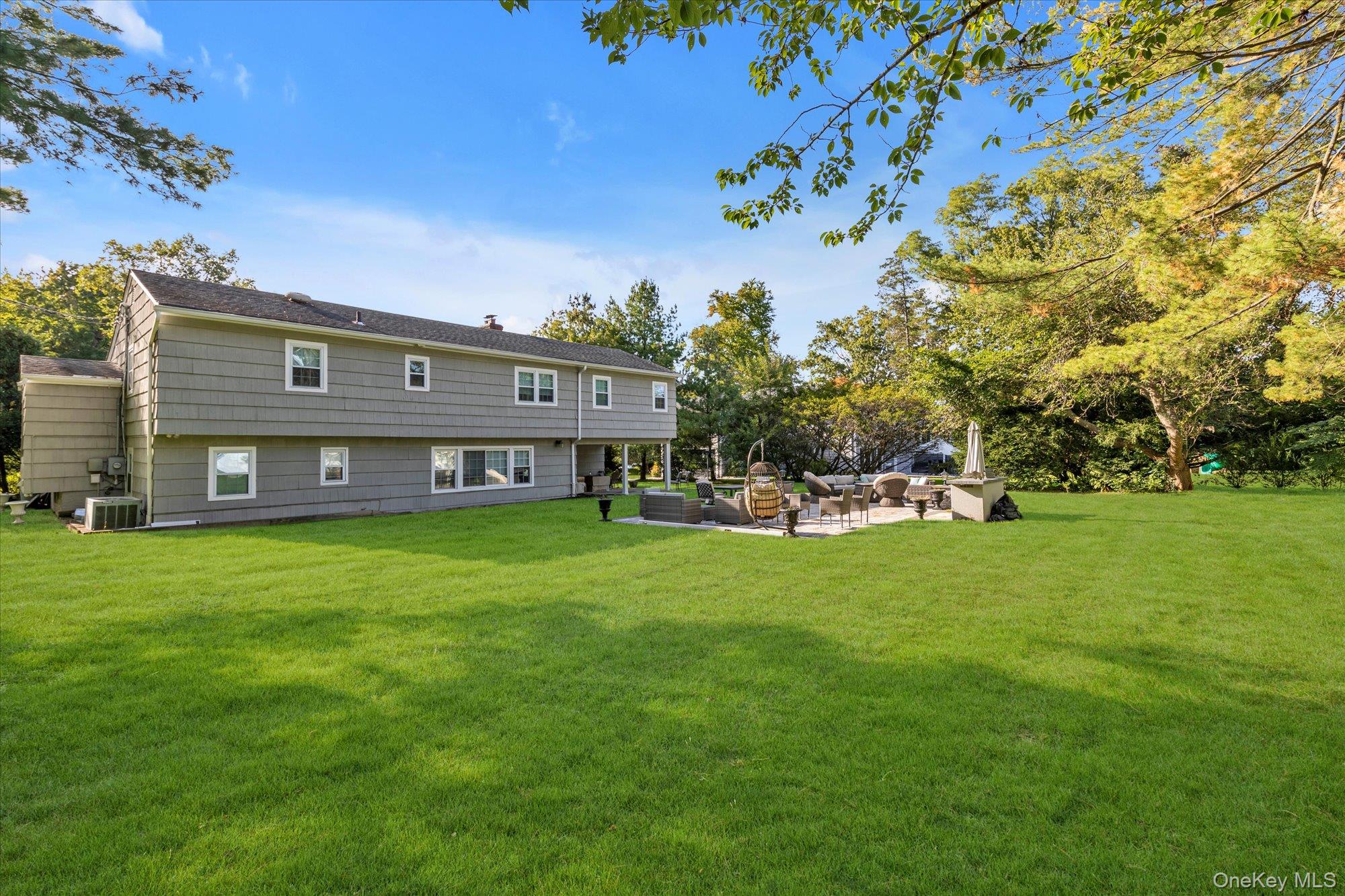47 Pinewood Road Roslyn, NY 11576 - Photo 20 of 22 a view of a house with a big yard
