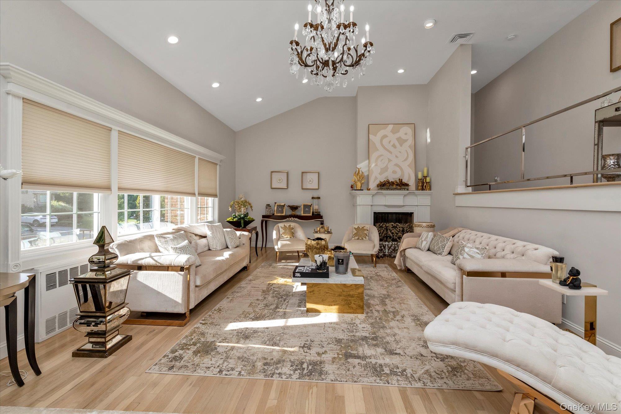 47 Pinewood Road Roslyn, NY 11576 - Photo 2 of 22 a living room with furniture fireplace and a large window