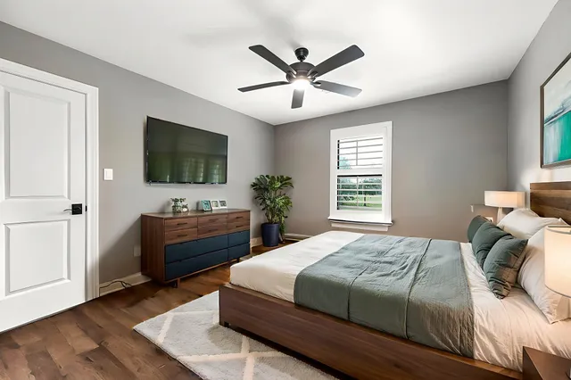 a bedroom with a bed and a window