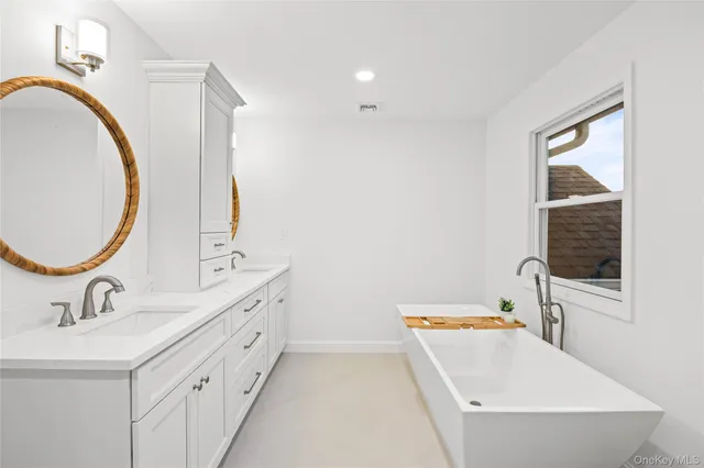 a bath tub sitting next to a window