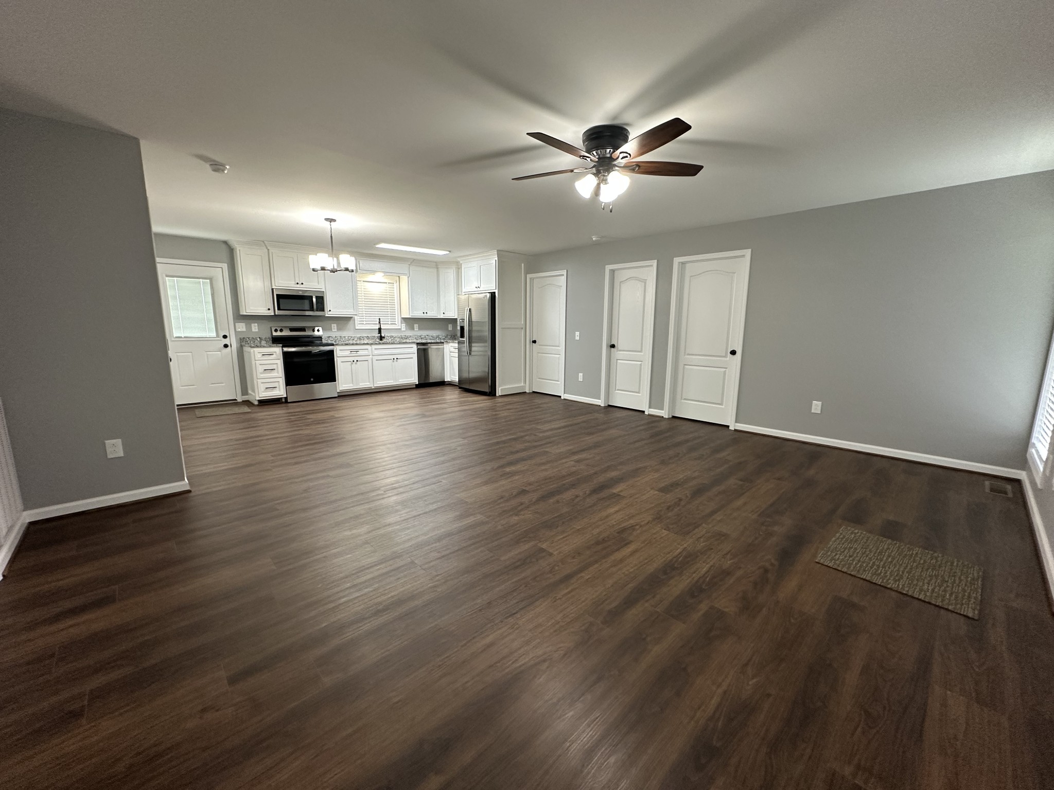 24 Henkle Lane Loretto, TN 38469 - Photo 11 of 21 a view of a livingroom with a ceiling fan window and wooden floor