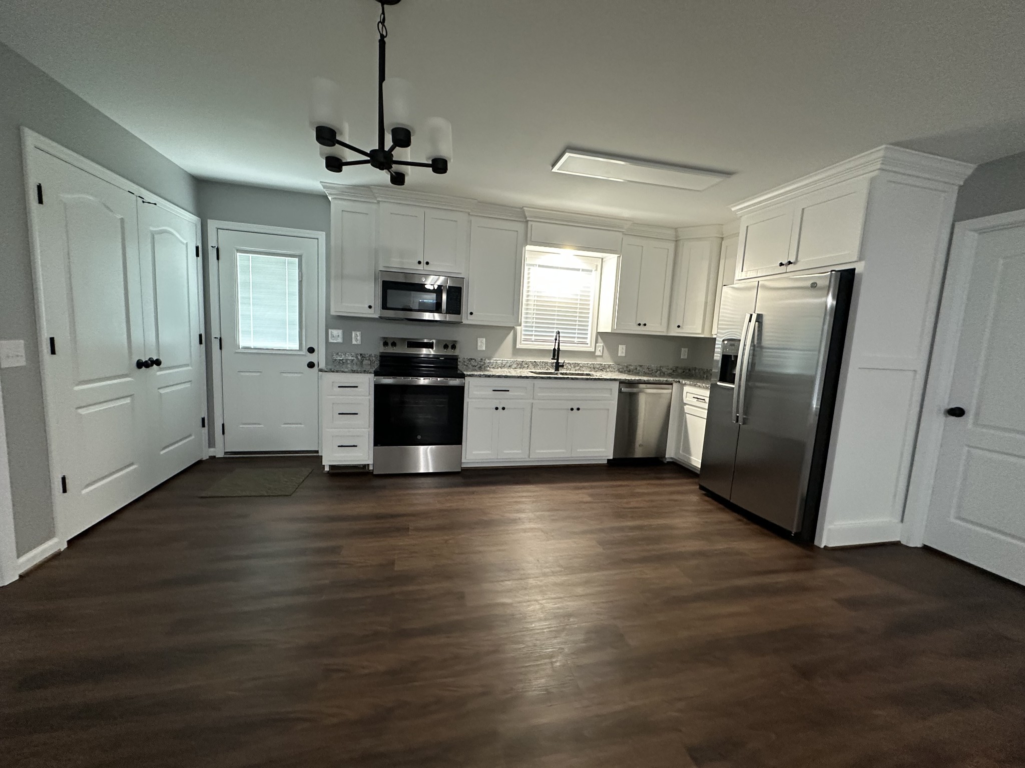24 Henkle Lane Loretto, TN 38469 - Photo 13 of 21 a kitchen with stainless steel appliances granite countertop a refrigerator and a stove top oven