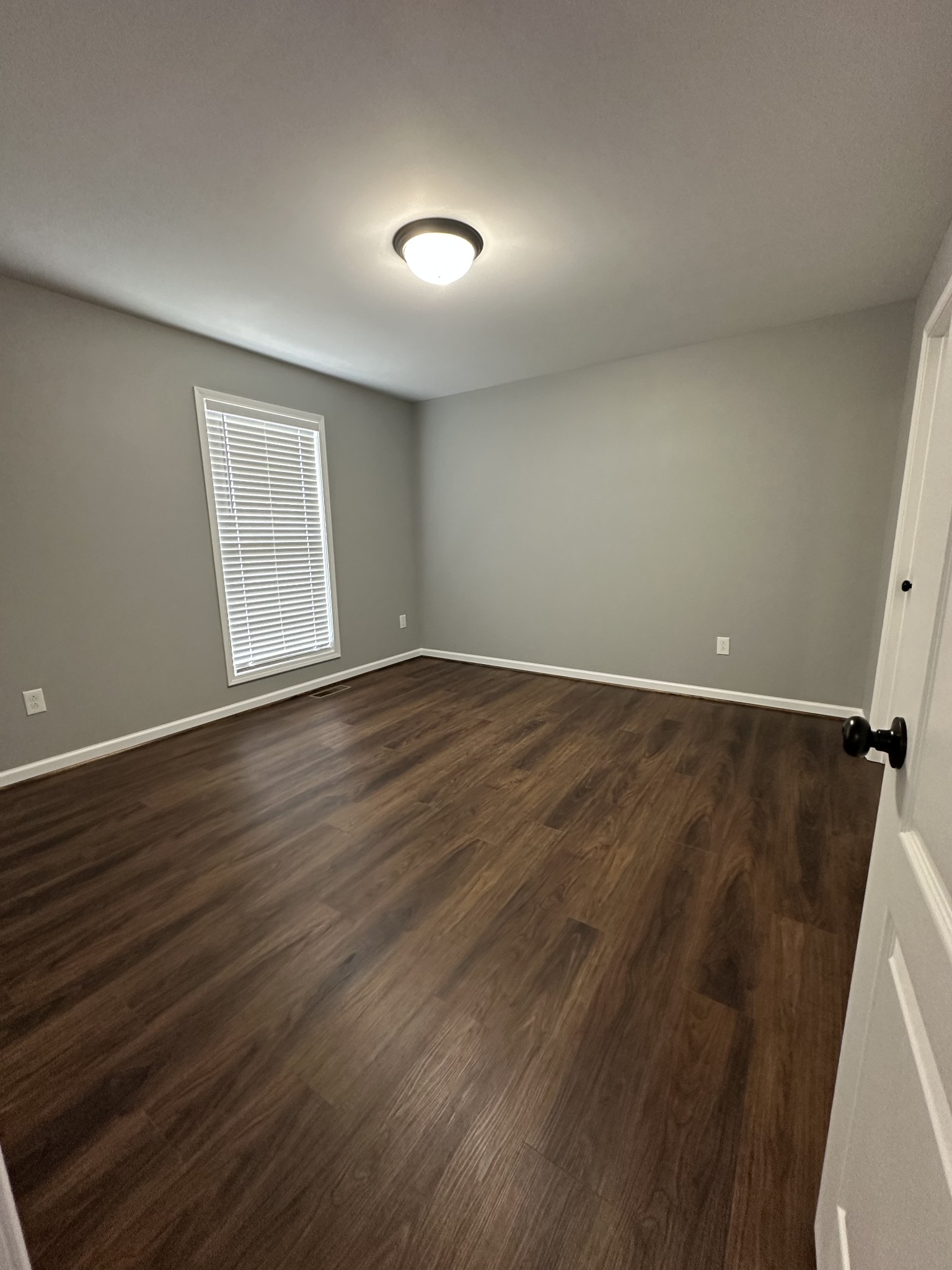 24 Henkle Lane Loretto, TN 38469 - Photo 20 of 21 a view of an empty room with wooden floor and a window