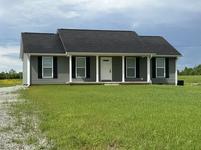 front view of a house with a yard