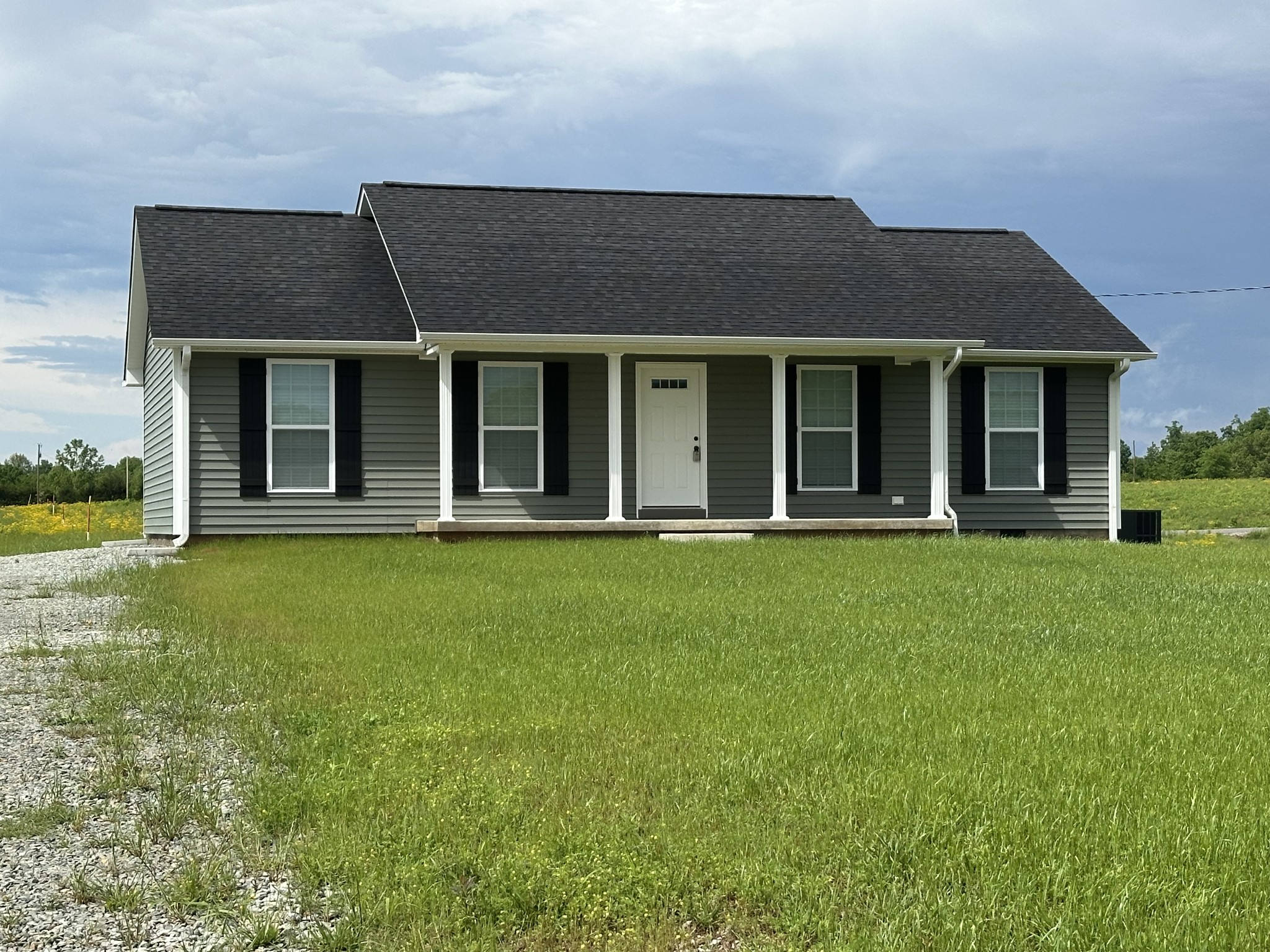 24 Henkle Lane Loretto, TN 38469 - Photo 5 of 21 front view of a house with a yard