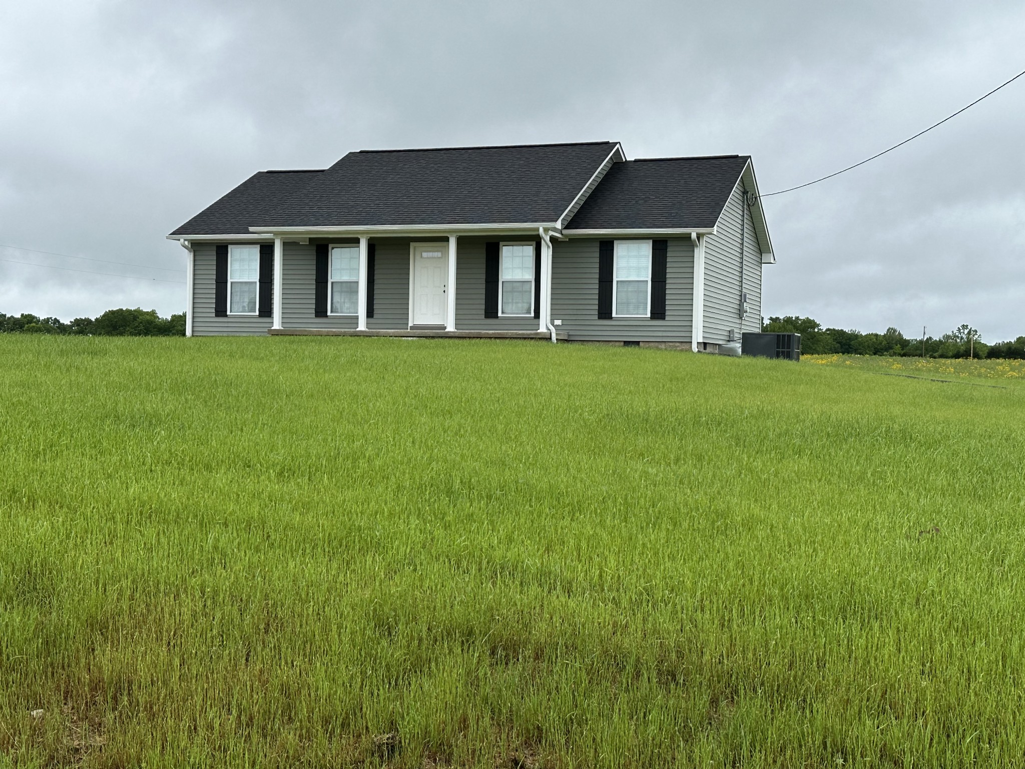24 Henkle Lane Loretto, TN 38469 - Photo 6 of 21 a front view of a house with a garden