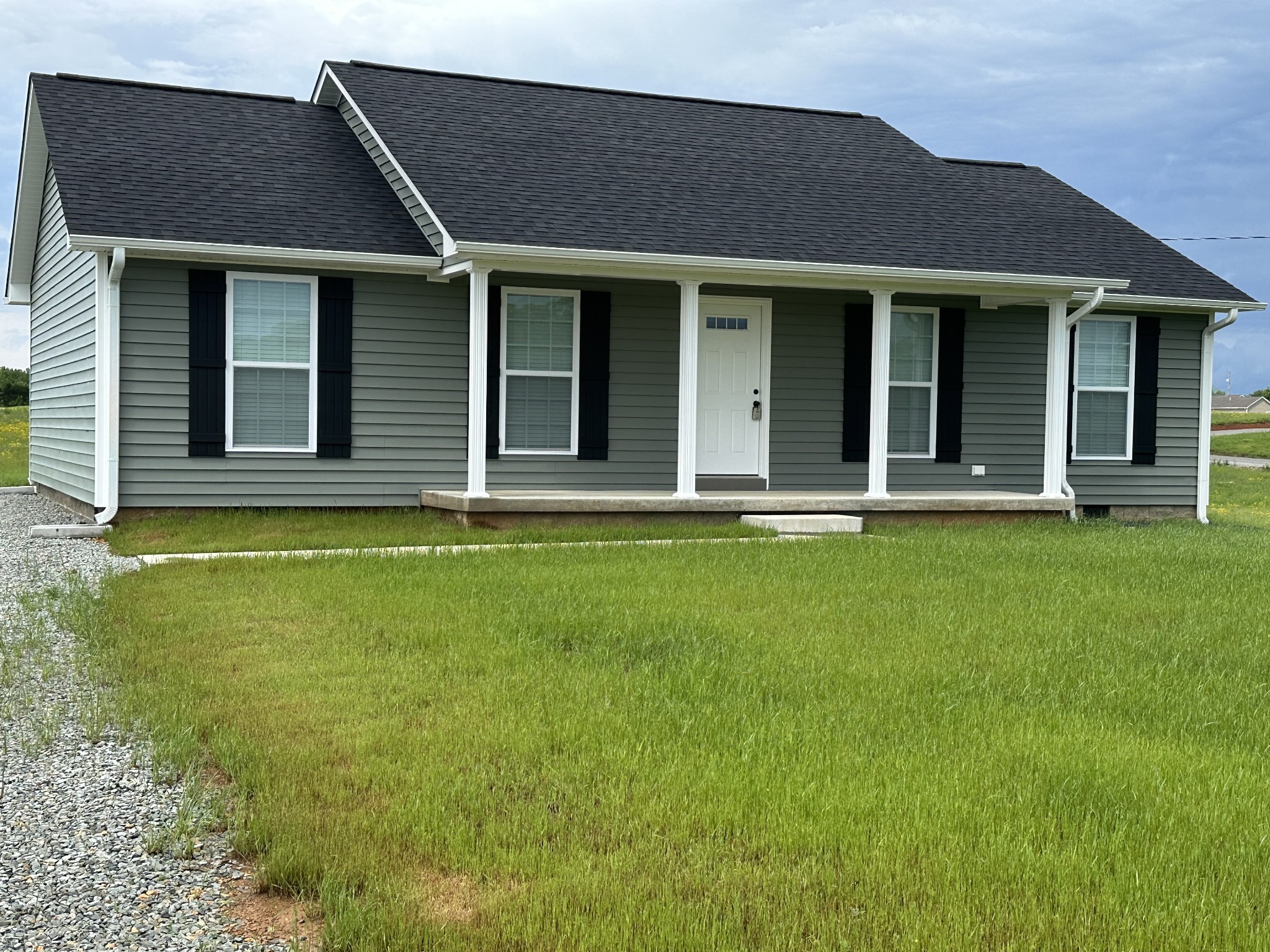 24 Henkle Lane Loretto, TN 38469 - Photo 7 of 21 a front view of a house with a yard
