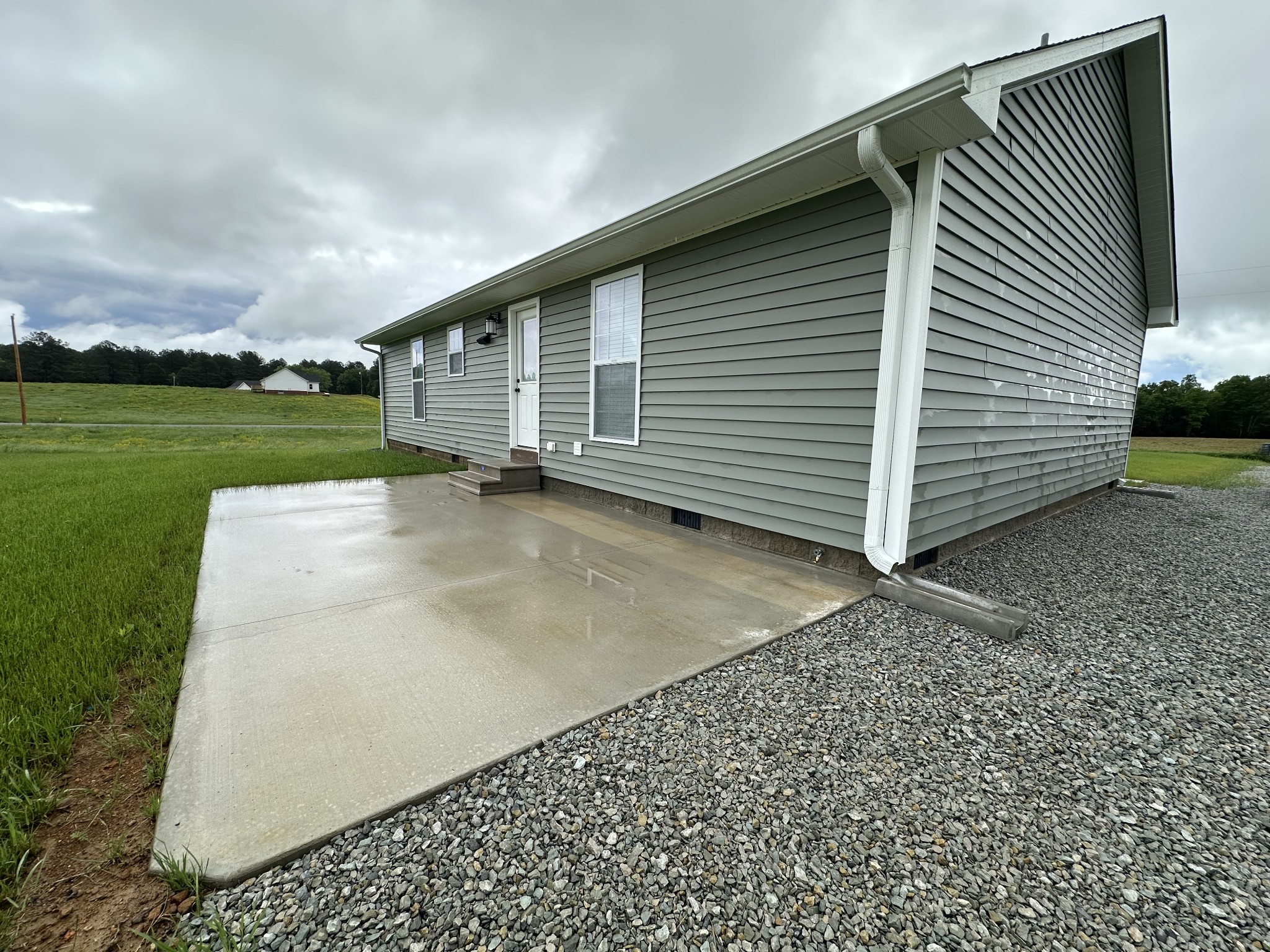 24 Henkle Lane Loretto, TN 38469 - Photo 9 of 21 a backyard of a house with lots of green space