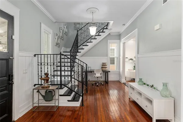a view of entryway with wooden floor