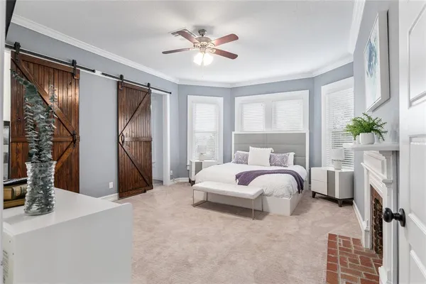 a bed room with a bed and a fireplace