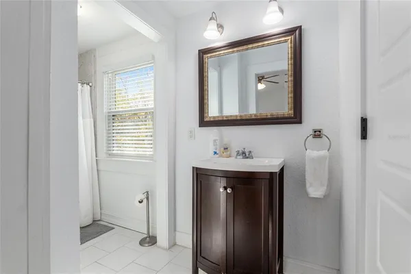 a white toilet sitting next to a bathroom sink