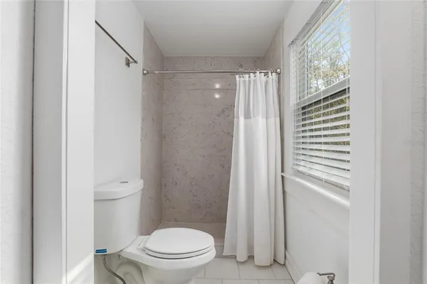 a bathroom with a sink and a window