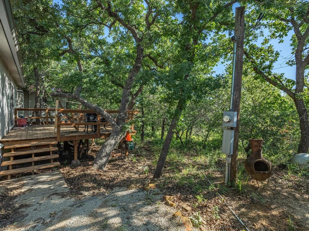 3275 Finis Road Graham, TX 76450 - Photo 30 of 36 a backyard of a house with lots of green space