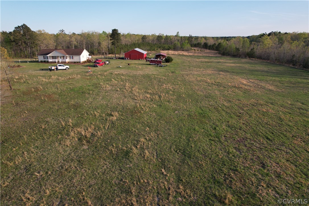 6851 Cox Road Wilsons, VA 23894 - Photo 11 of 50 a backyard of a house with lots of green space