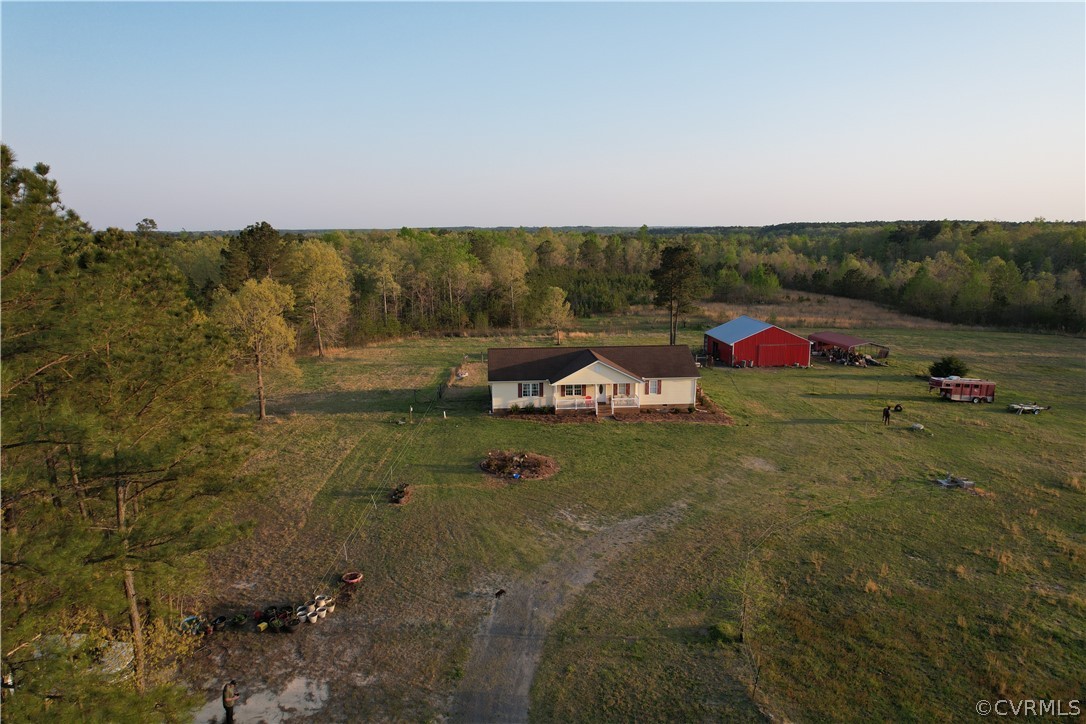 6851 Cox Road Wilsons, VA 23894 - Photo 20 of 50 a view of yard with seating area and green space