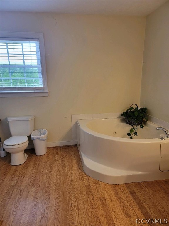 6851 Cox Road Wilsons, VA 23894 - Photo 41 of 50 a bathroom with a bathtub and toilet