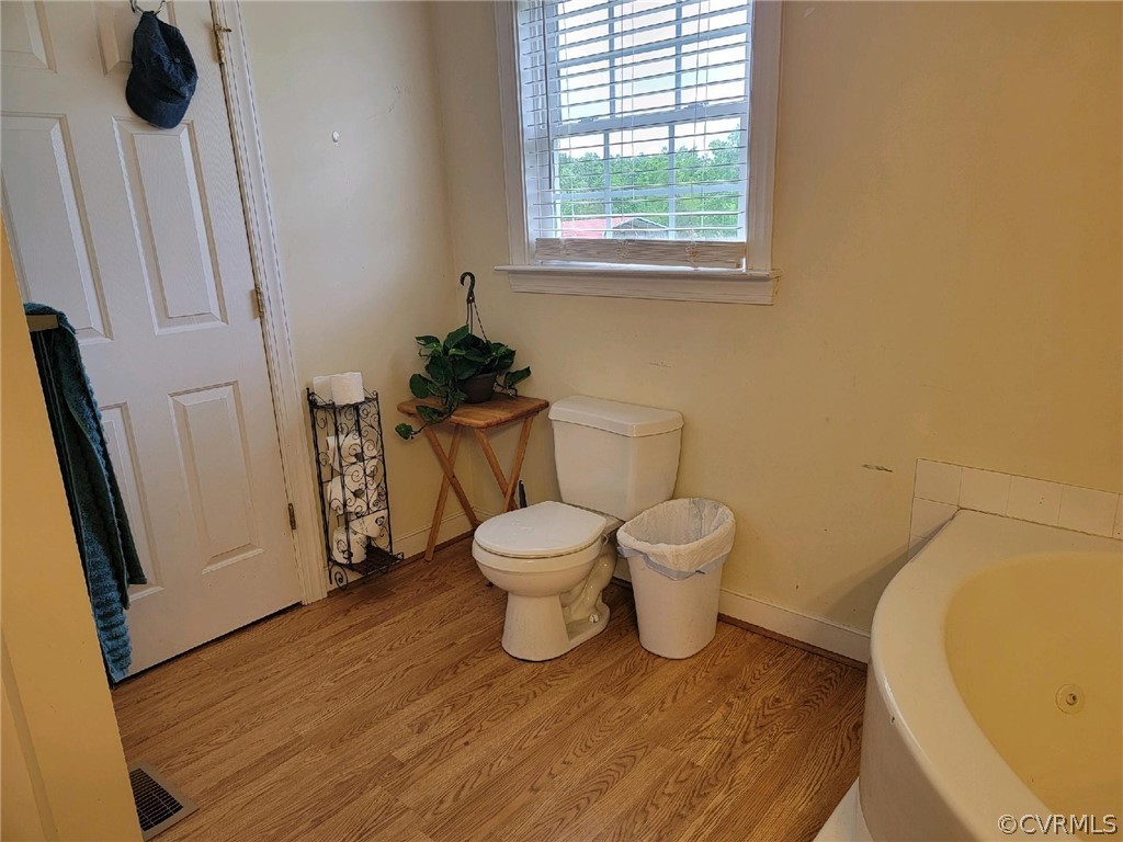 6851 Cox Road Wilsons, VA 23894 - Photo 44 of 50 a bathroom with a toilet and a tub