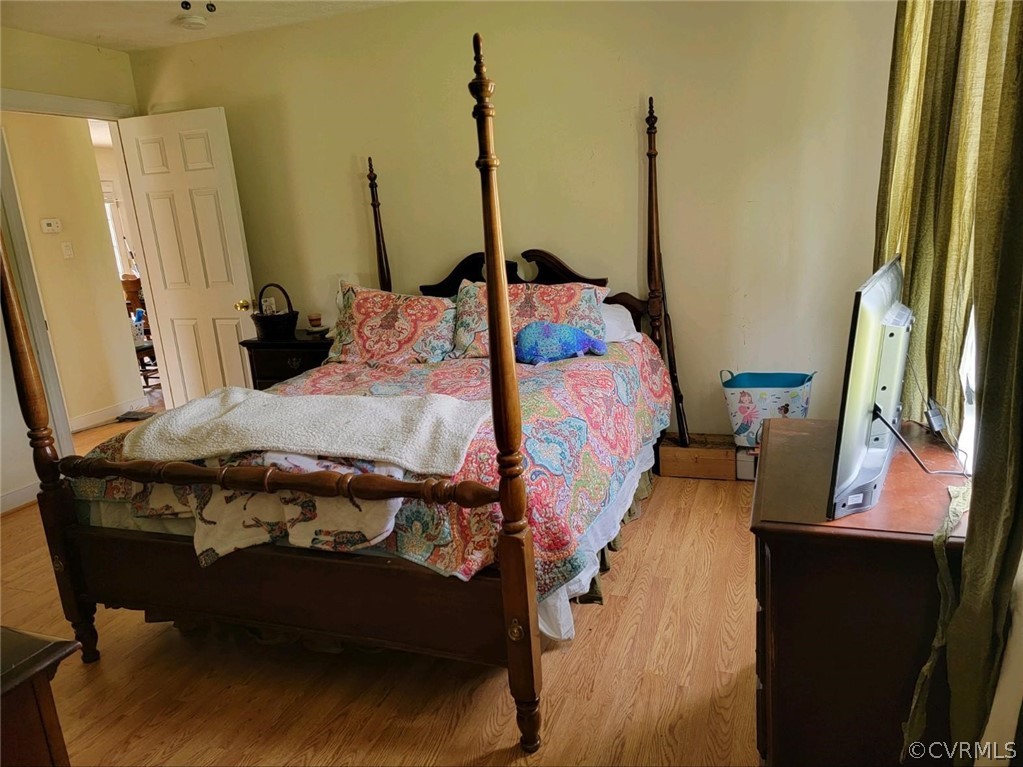 6851 Cox Road Wilsons, VA 23894 - Photo 50 of 50 a bed sitting in a bedroom next to a window