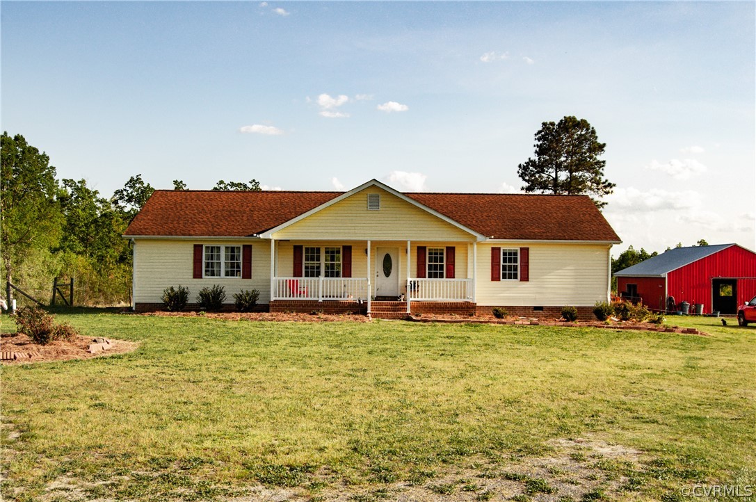 6851 Cox Road Wilsons, VA 23894 - Photo 5 of 50 a front view of a house with a yard