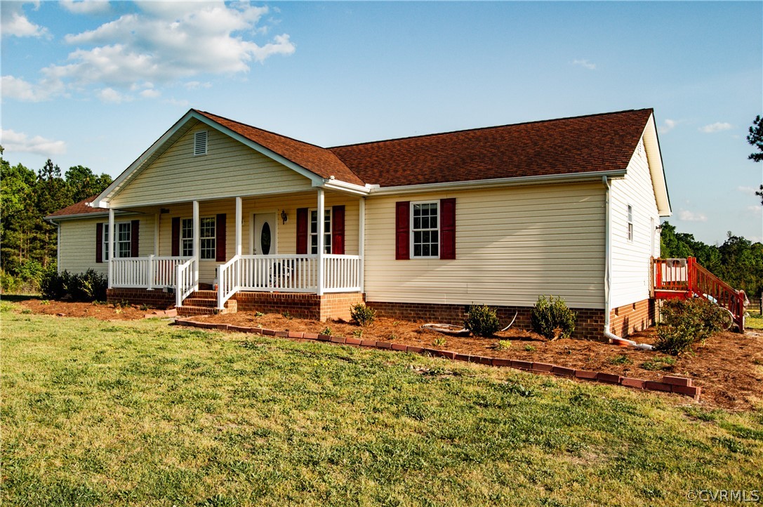 6851 Cox Road Wilsons, VA 23894 - Photo 6 of 50 a backyard of a house with table and chairs