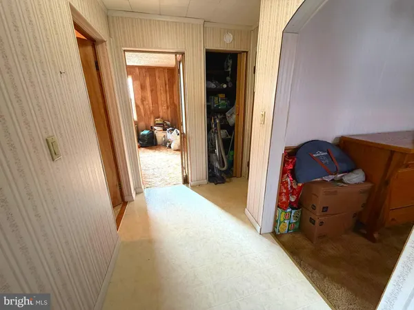 a bedroom with a bed and a table