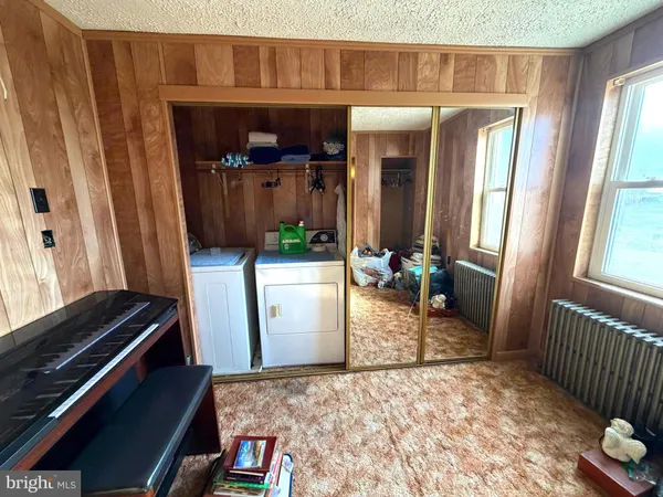 a view of hallway with wooden floor and wooden floor