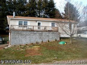 22 Tyler Street Clyde, NC 28721 - Photo 1 of 9 a view of a house with a yard